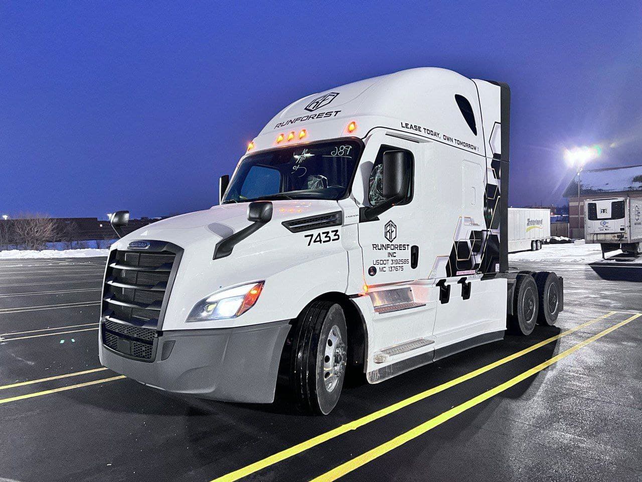 RUNFOREST truck at dusk with “Lease today, own tomorrow” on the sleeper