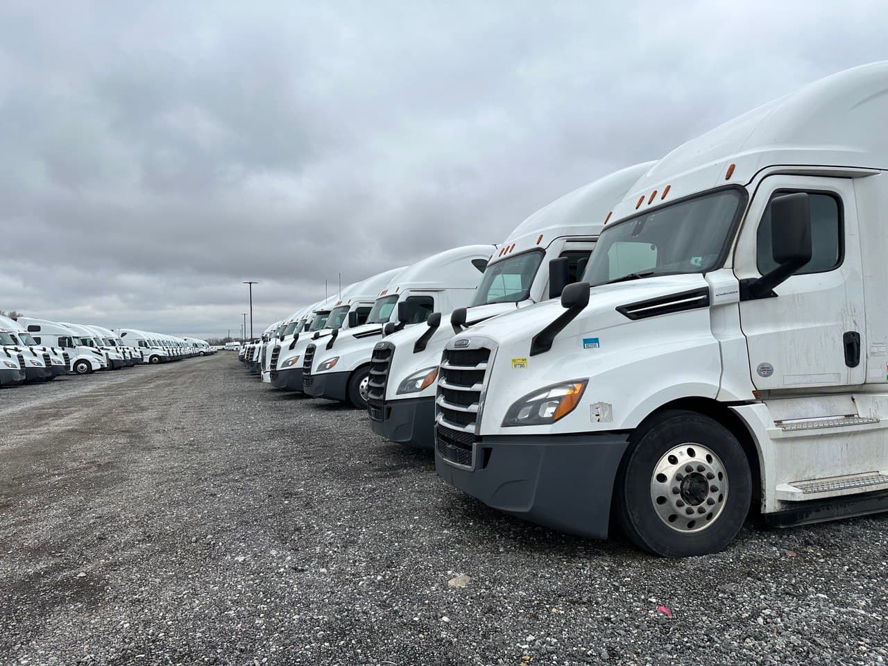 A row of RUNFOREST trucks in the yard